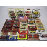 A collection of die-cast vehicles including Matchbox Models of Yesteryear, Lledo Models of Days