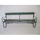 A green painted garden bench with metal supports - A/F