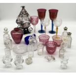 A collection of various glassware etc including iridescent vase, art glass goblets, scent bottles