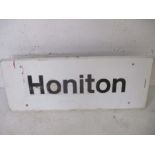 A mid century railway station platform sign for Honiton with fittings for pole to reverse