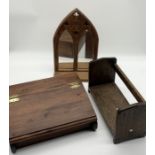 A ecclesiastical style mirror, wooden writing slope and small bookshelf