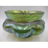 A Loetz style iridescent glass lobed rose bowl, c.1905, with a pale green spotted lustre, pontil