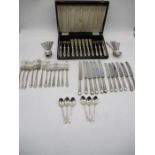 A suite of silver plated cutlery along with a cased set of fish knives and forks