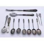A collection of hallmarked silver and silver handled cutlery including apostle spoons