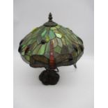 A tiffany style lamp with dragonfly design