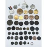 A collection of copper coins and tokens including some hammered coinage along with a small selection