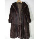 A 3/4 length mink coat, embroidered flowers to lining