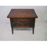 An oak sewing box with carved decoration