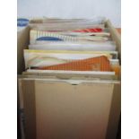 A box of 45 rpm 7 inch vinyl records