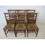 A set of six rush seated chapel chairs