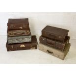 A collection of seven vintage travel trunks and suitcases