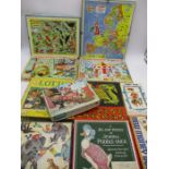 A collection of vintage games and jigsaw puzzles including Magic Roundabout, Victory puzzles etc.