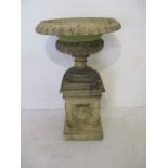 A large antique garden urn on plinth, height 125cm, diameter 74cm