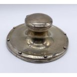 A hallmarked silver inkwell in the form of a capstan