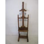 A Victorian adjustable oak artists easel. Makers plaque to reverse "Lechertier, Barbe &Co" Wooden