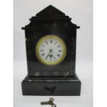 A black slate mantle clock with marbled detailing