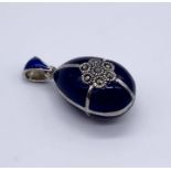 A 925 silver enamelled Faberge style egg pendant set with marcasite