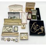 A collection of costume jewellery including a silver cross