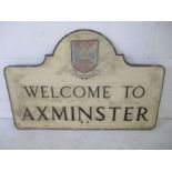 A vintage cast metal sign "Welcome to Axminster"