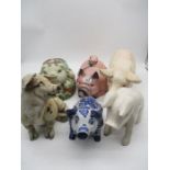 Six large porcelain ornamental pigs
