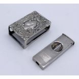 A hallmarked silver matchbox holder along with a 935 silver cigar cutter