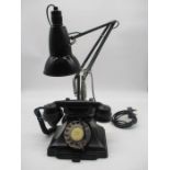 A vintage telephone and an anglepoise lamp.