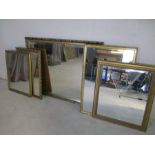 Five gilt mirrors of varying sizes