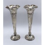 A pair of hallmarked silver trumpet vases
