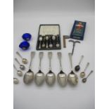 An assortment of seven silver spoons, plus several silver plated spoons, etc