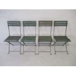 A set of four folding band stand chairs with wooden slatted seats