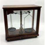 A cased set of scientific scales Philip Harris & Co. Ltd
