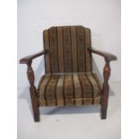 An oak framed low armchair.