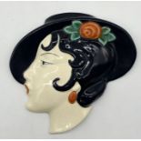 An Art Deco Czechoslovakian ceramic wall mask similar in style to Cope and Co. 18cm high.