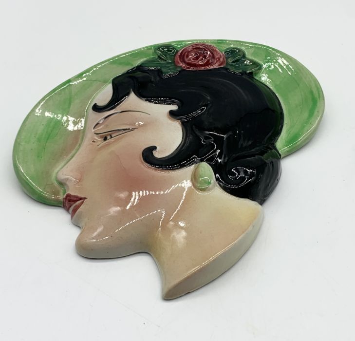 A ceramic Art Deco wall plaque by Cope and Co. depicting a lady in green hat. 16.5cm x 17cm. - Image 2 of 3