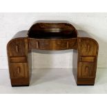 A burr walnut Art Deco ladies writing desk with leather top, six drawers and two further secret