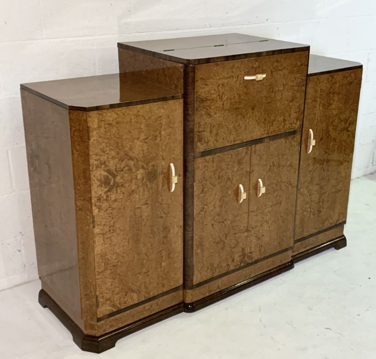 An Art Deco Amboyna cocktail cabinet with lift up top containing original mirror, juicer and - Image 3 of 7