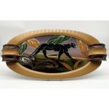 An Art Deco tray with back painted glass panel depicting a panther signed Dope