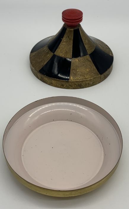 A French Art Deco gilt metal and black enamel powder with red celluloid finial and mirror to - Image 2 of 3