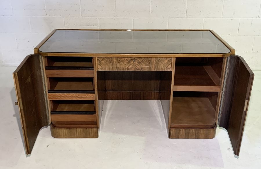 An Art Deco figured walnut desk with rounded rectangular writing surface with twin panelled doors - Image 3 of 6