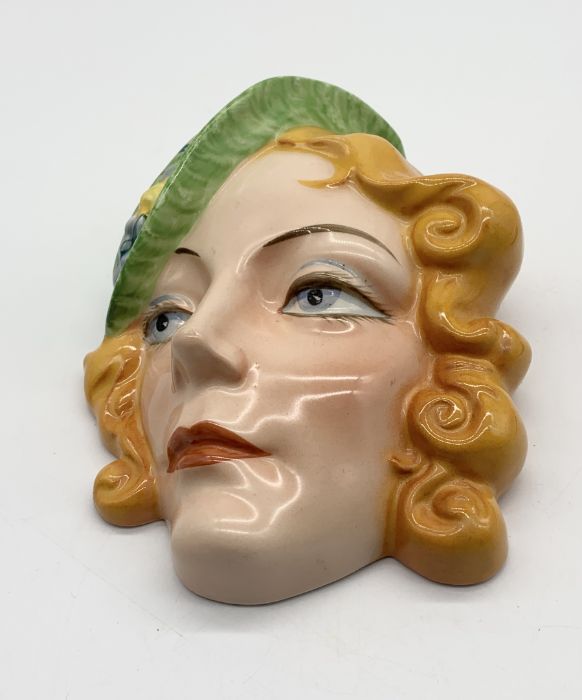 A Czechoslovakian Art Deco ceramic wall mask with green hat - numbered to the back. 18cm high. - Image 2 of 3