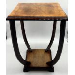 A French Art Deco walnut occasional table on bowed legs