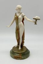 Ferdinand Preiss (1882 -1943) Cold-painted bronze and ivory figure of a semi-nude young lady holding