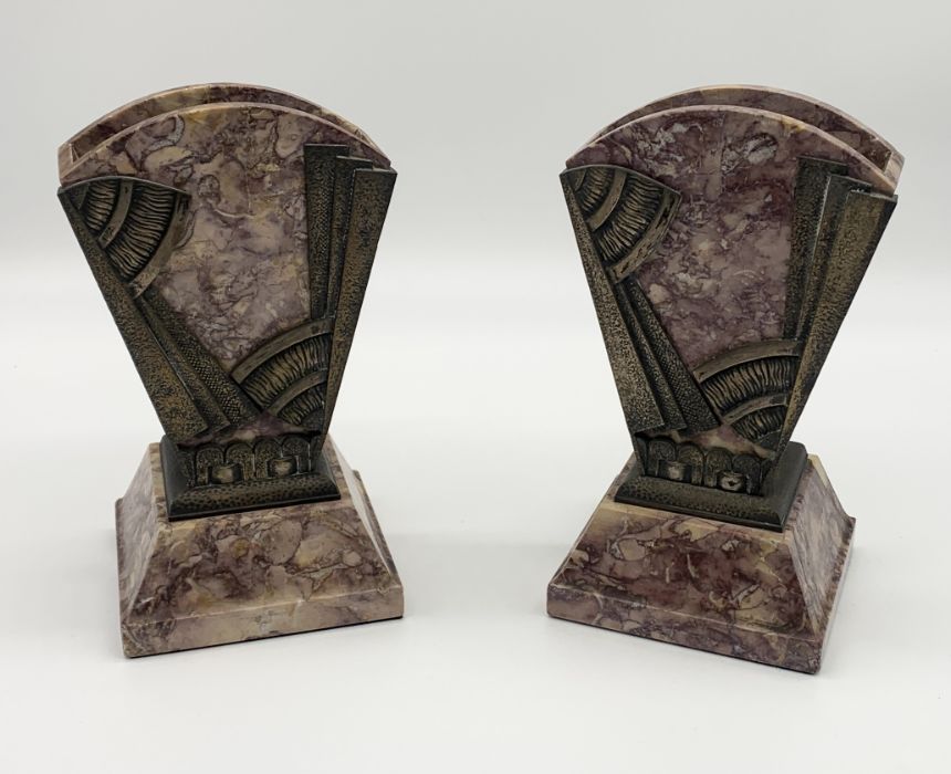 An Art Deco pink marble clock and garnitures with bronze face and mounts adorned with two silvered - Image 5 of 6