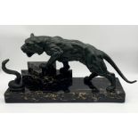 A large Art Deco spelter figure group on stepped marble base depicting a tiger and a cobra length