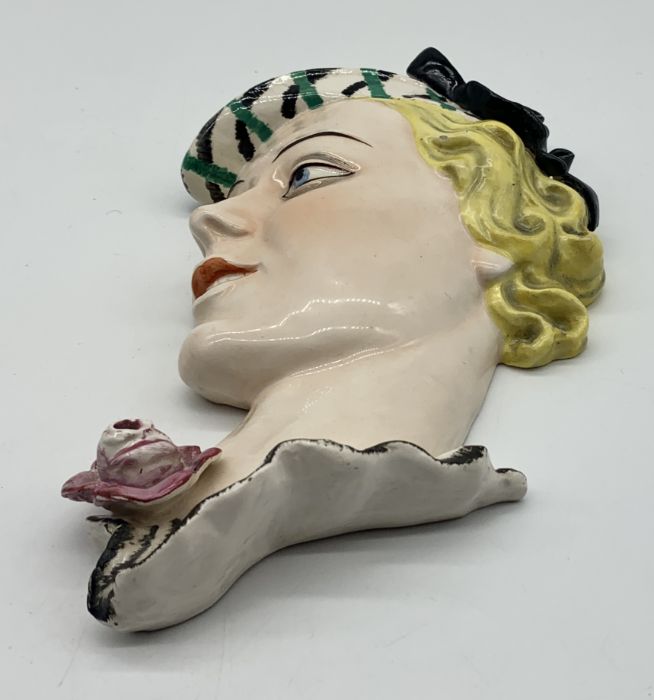 An Art Deco wall mask of a ladies head with a flower - marked to reverse F.X. 47. - Image 2 of 3