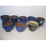 A collection of 8 blue glazed garden pots, including Heritage Garden Pottery.