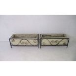 Two garden troughs in wrought iron frames, length 84cm.