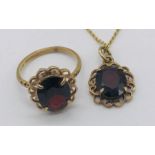 A 9ct gold ring and pendant set, each set with a garnet, total weight 5.2g