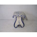 A blue and white pottery garden seat