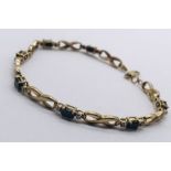 A 9ct gold bracelet set with diamonds and sapphires, weight 5.5g